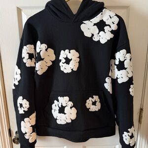 Denim Tears Black Hoodie with White Floral Design